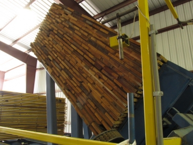 Side view of lumber raised by tilt hoist
